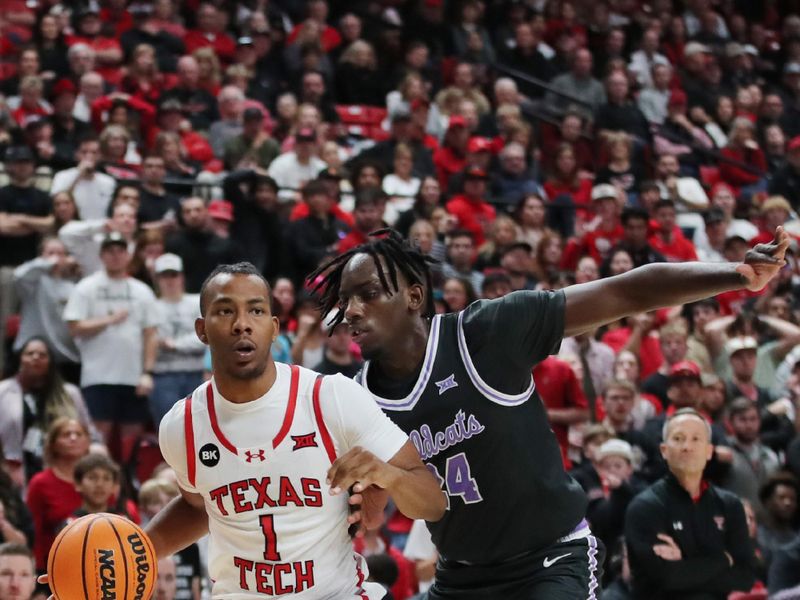 Jan 13, 2024; Lubbock, Texas, USA;  Texas Tech Red Raiders guard Lamar Washington (1) dribbles the ball against Kansas State Wildcats wing Arthur Kaluma (24) in the second half at United Supermarkets Arena. Mandatory Credit: Michael C. Johnson-USA TODAY Sports