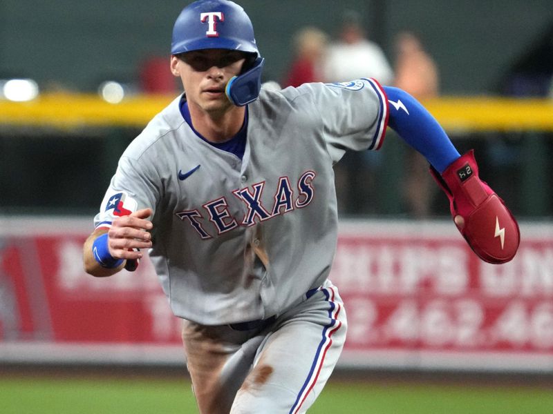 Sep 3, 2025; Phoenix, Arizona, USA; Texas Rangers outfielder Michael Helman (24) runs the bases against the Arizona Diamondbacks in the first inning at Chase Field. Mandatory Credit: Rick Scuteri-Imagn Images