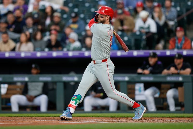 May 19, 2025; Denver, Colorado, USA; Philadelphia Phillies first baseman Bryce Harper (3) hits a single in the third inning against the Colorado Rockies at Coors Field. Mandatory Credit: Isaiah J. Downing-Imagn Images