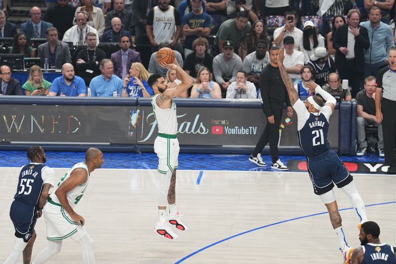 DALLAS, TX - JUNE 14: Jayson Tatum #0 of the Boston Celtics shoots a three point basket during the game against the Dallas Mavericks during Game Four of the 2024 NBA Finals on June 14, 2024 at the American Airlines Center in Dallas, Texas. NOTE TO USER: User expressly acknowledges and agrees that, by downloading and or using this photograph, User is consenting to the terms and conditions of the Getty Images License Agreement. Mandatory Copyright Notice: Copyright 2024 NBAE (Photo by Glenn James/NBAE via Getty Images)