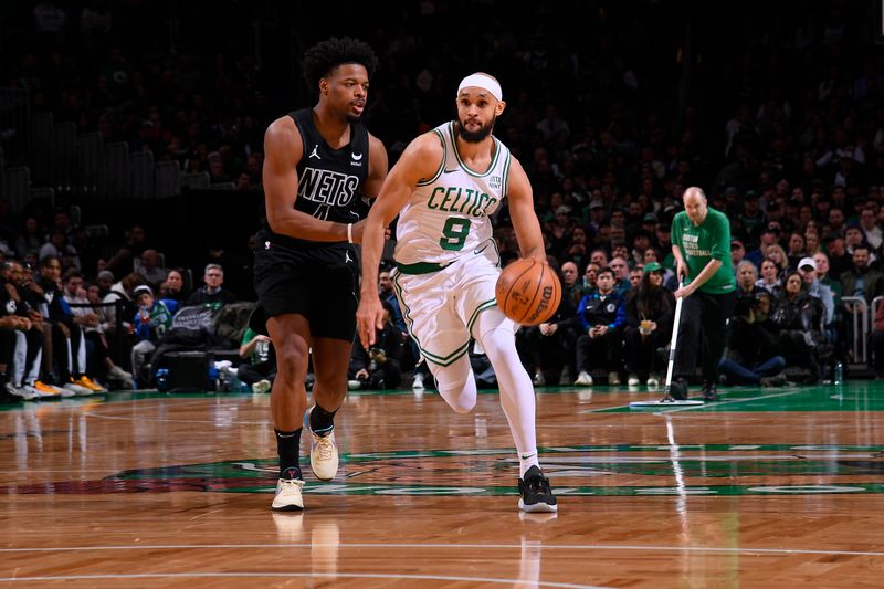 BOSTON, MA - FEBRUARY 14: Derrick White #9 of the Boston Celtics handles the ball during the game against the Brooklyn Nets on February 14, 2024 at the TD Garden in Boston, Massachusetts. NOTE TO USER: User expressly acknowledges and agrees that, by downloading and or using this photograph, User is consenting to the terms and conditions of the Getty Images License Agreement. Mandatory Copyright Notice: Copyright 2024 NBAE  (Photo by Brian Babineau/NBAE via Getty Images)