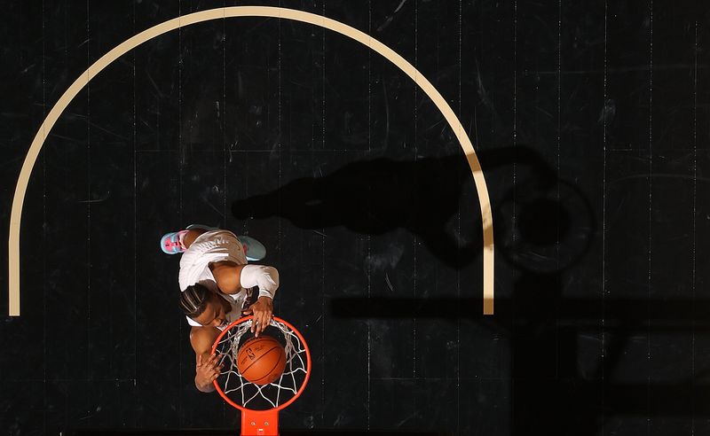 ATLANTA, GEORGIA - MARCH 06:  Isaac Okoro #35 of the Cleveland Cavaliers dunks against the Atlanta Hawks during the fourth quarter at State Farm Arena on March 06, 2024 in Atlanta, Georgia.  NOTE TO USER: User expressly acknowledges and agrees that, by downloading and/or using this photograph, user is consenting to the terms and conditions of the Getty Images License Agreement.  (Photo by Kevin C. Cox/Getty Images)