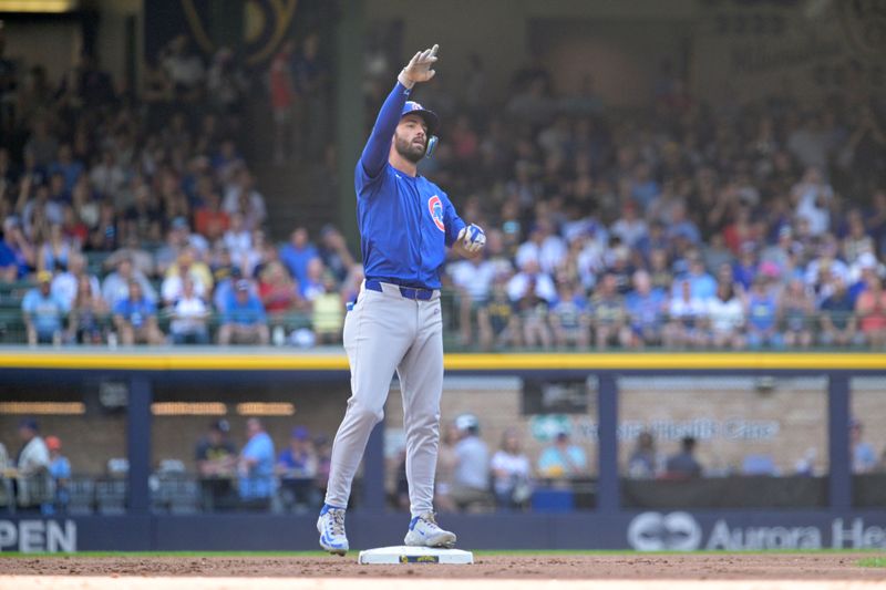 Jun 29, 2024; Milwaukee, Wisconsin, USA; Chicago Cubs shortstop Dansby Swanson (7) celebrates hitting a double in the third inning against the Milwaukee Brewers  at American Family Field. Mandatory Credit: Michael McLoone-USA TODAY Sports