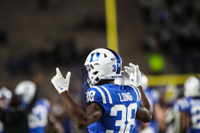 Nov 18, 2021; Durham, North Carolina, USA;  Duke Blue Devils cornerback Dominique Long (38) celebrates a touchdown during the 1st half of the game against the Louisville Cardinals at Wallace Wade Stadium. Mandatory Credit: Jaylynn Nash-USA TODAY Sports