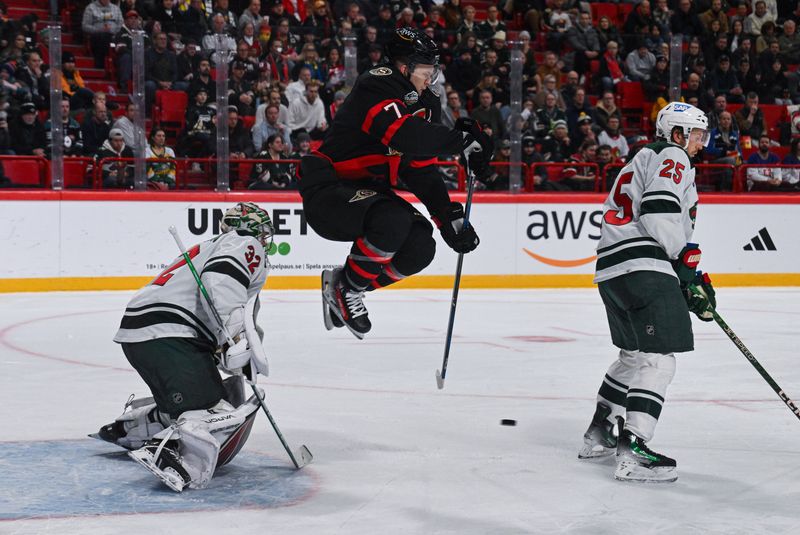 Nov 18, 2023; Stockholm, SWE; Ottawa Senators left wing Brady Tkachuk (7) attempts to deflect the puck past Minnesota Wild goaltender Filip Gustavsson (32) during a Global Series NHL hockey game at Avicii Arena. Mandatory Credit: Per Haljestam-USA TODAY Sports