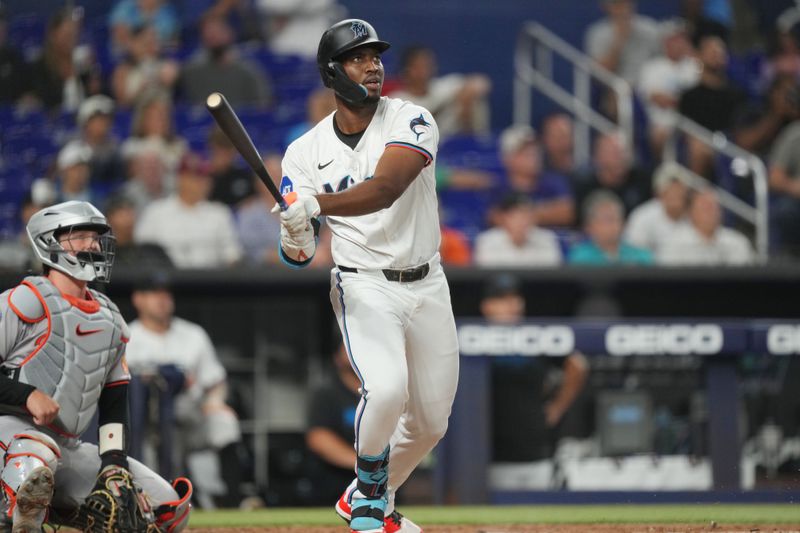 Jul 23, 2024; Miami, Florida, USA;  Miami Marlins right fielder Jesús Sánchez (12) hits a solo home run in the second inning against the Baltimore Orioles at loanDepot Park. Mandatory Credit: Jim Rassol-USA TODAY Sports