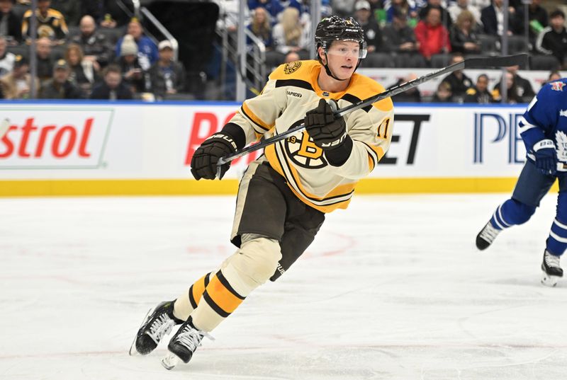 Dec 2, 2023; Toronto, Ontario, CAN; Boston Bruins forward Trent Frederic (11) pursues the play against the Toronto Maple Leafs in the second period at Scotiabank Arena. Mandatory Credit: Dan Hamilton-USA TODAY Sports