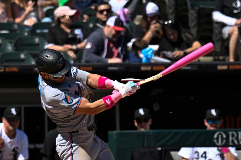 May 11, 2025; Chicago, Illinois, USA;   Miami Marlins third baseman Connor Norby (1) breaks his bat while batting against the Chicago White Sox during the sixth inning at Rate Field. Mandatory Credit: Matt Marton-Imagn Images