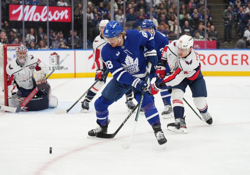 Dec 6, 2024; Toronto, Ontario, CAN; Toronto Maple Leafs right wing William Nylander (88) battles for the puck with Washington Capitals defenseman Martin Fehervary (42) in front of goaltender Charlie Lindgren (79) during the first period at Scotiabank Arena. Mandatory Credit: Nick Turchiaro-Imagn Images