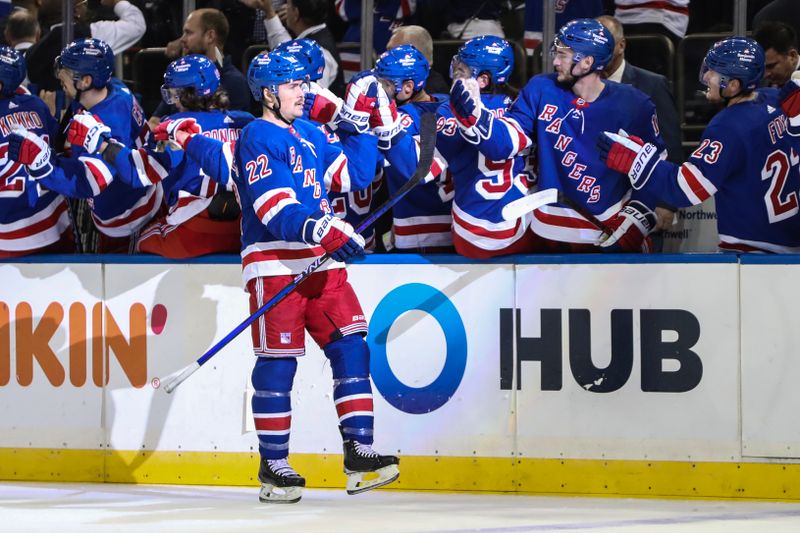 Nov 13, 2022; New York, New York, USA;  New York Rangers center Ryan Carpenter (22) is greeted by his teammates after scoring a goal in the third period against the Arizona Coyotes at Madison Square Garden. Mandatory Credit: Wendell Cruz-USA TODAY Sports