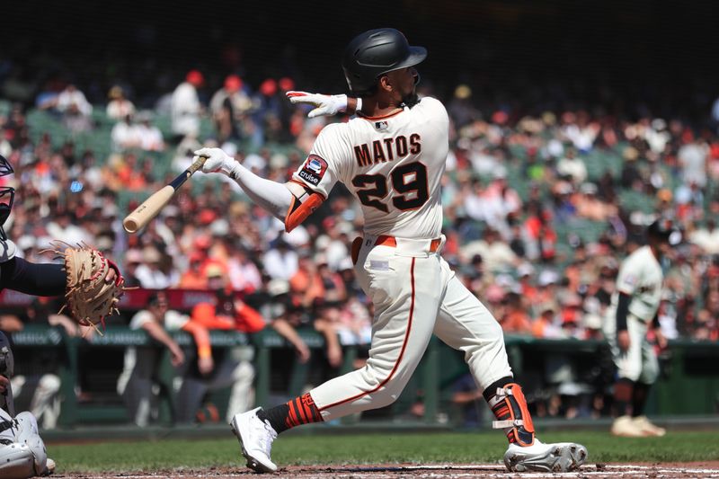 Sep 13, 2023; San Francisco, California, USA; San Francisco Giants center fielder Luis Matos (29) hits an RBI double during the first inning against the Cleveland Guardians at Oracle Park. Mandatory Credit: Sergio Estrada-USA TODAY Sports