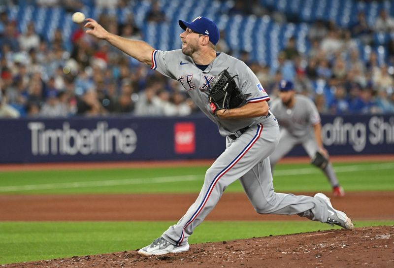 Sep 12, 2023; Toronto, Ontario, CAN;  Texas Rangers starting pitcher Max Scherzer (31) delivers a pitch against the Toronto Blue Jays in the fourth inning at Rogers Centre. Mandatory Credit: Dan Hamilton-USA TODAY Sports