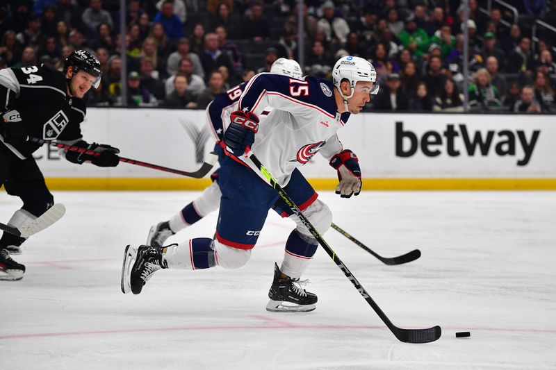 Mar 16, 2023; Los Angeles, California, USA; Columbus Blue Jackets defenseman Gavin Bayreuther (15) moves the puck against the Los Angeles Kings during the second period at Crypto.com Arena. Mandatory Credit: Gary A. Vasquez-USA TODAY Sports