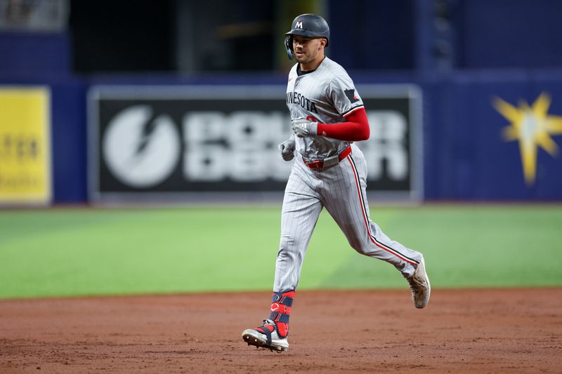 Sep 2, 2024; St. Petersburg, Florida, USA; -Minnesota Twins outfielder Trevor Larnach (9) runs the bases after hitting a three-run home run against the Tampa Bay Rays in the second inning at Tropicana Field. Mandatory Credit: Nathan Ray Seebeck-USA TODAY Sports