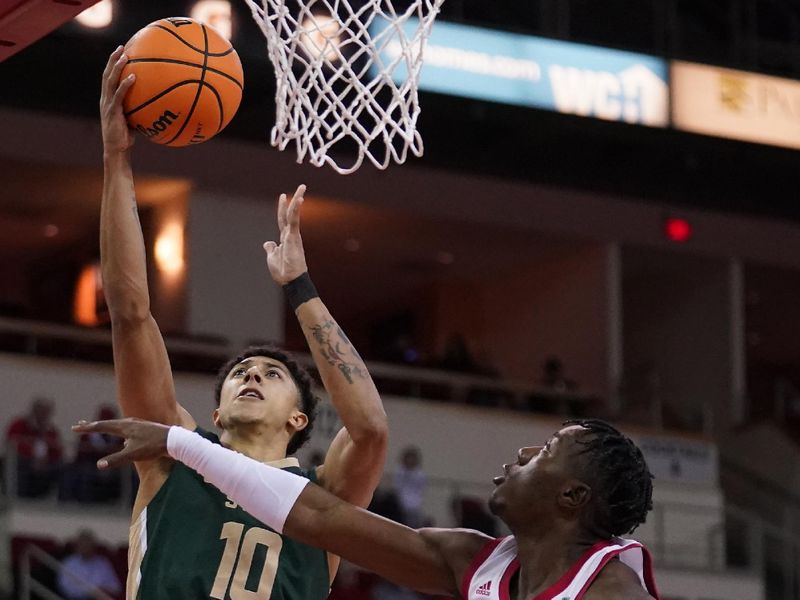 Feb 3, 2024; Fresno, California, USA; Colorado State Rams guard Nique Clifford (10) makes a basket in front of Fresno State Bulldogs guard Jalen Weaver (5) in the first half at the Save Mart Center. Mandatory Credit: Cary Edmondson-USA TODAY Sports