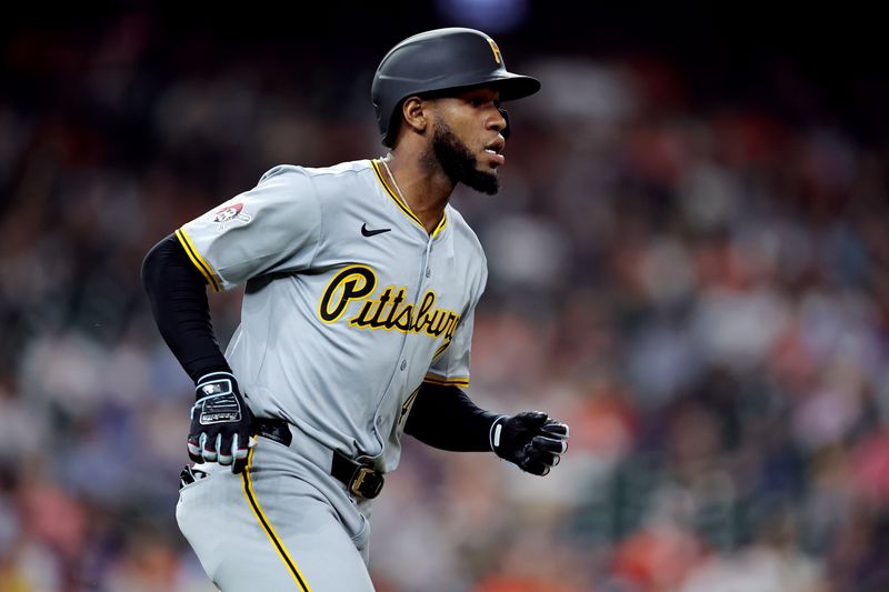 Jul 31, 2024; Houston, Texas, USA; Pittsburgh Pirates right fielder Bryan De La Cruz (41) runs to first after hitting a single against the Houston Astros during the eighth inning at Minute Maid Park. Mandatory Credit: Erik Williams-USA TODAY Sports