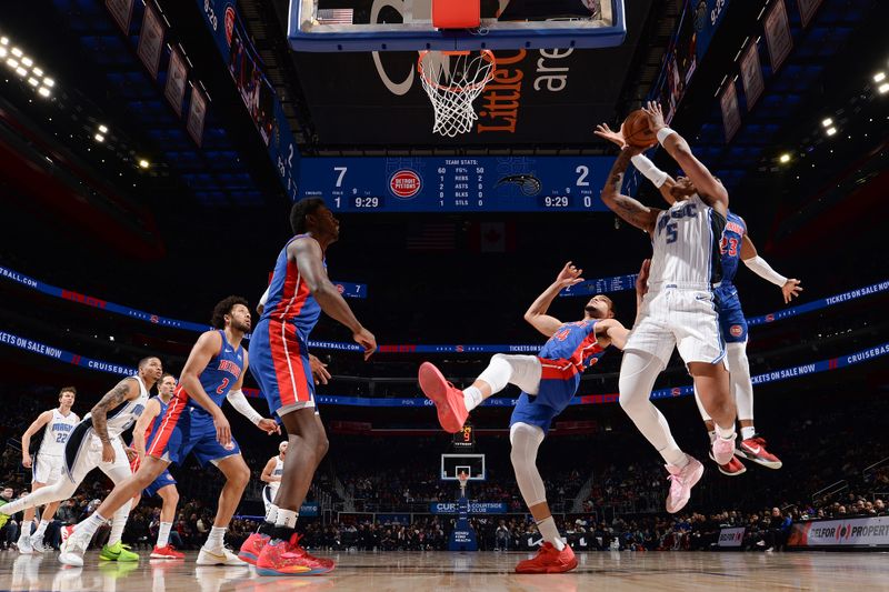 DETROIT, MI - FEBRUARY 4: Paolo Banchero #5 of the Orlando Magic drives to the basket during the game  against the Detroit Pistons on February 4, 2024 at Little Caesars Arena in Detroit, Michigan. NOTE TO USER: User expressly acknowledges and agrees that, by downloading and/or using this photograph, User is consenting to the terms and conditions of the Getty Images License Agreement. Mandatory Copyright Notice: Copyright 2024 NBAE (Photo by Chris Schwegler/NBAE via Getty Images)