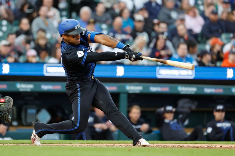 May 10, 2024; Detroit, Michigan, USA;  Detroit Tigers second base Andy Ibanez (77) hits a single in the fifth inning against the Houston Astros at Comerica Park. Mandatory Credit: Rick Osentoski-USA TODAY Sports