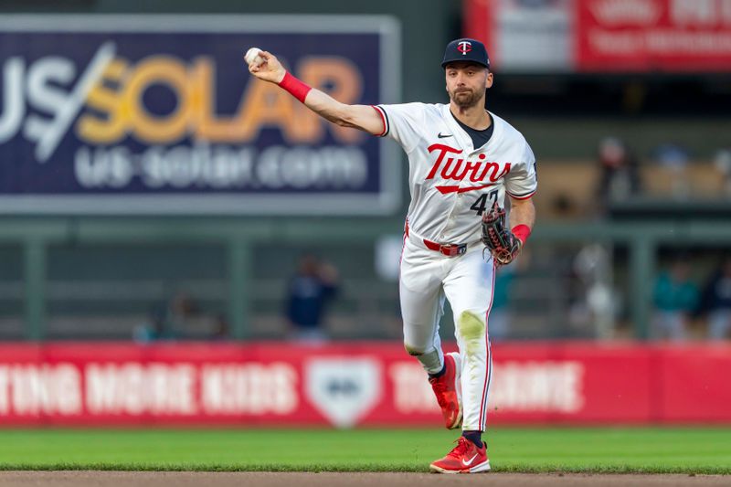 May 8, 2024; Minneapolis, Minnesota, USA; Minnesota Twins second baseman Edouard Julien (47) throws the ball to first base for an out against the Seattle Mariners in the fifth inning at Target Field. Mandatory Credit: Jesse Johnson-USA TODAY Sports