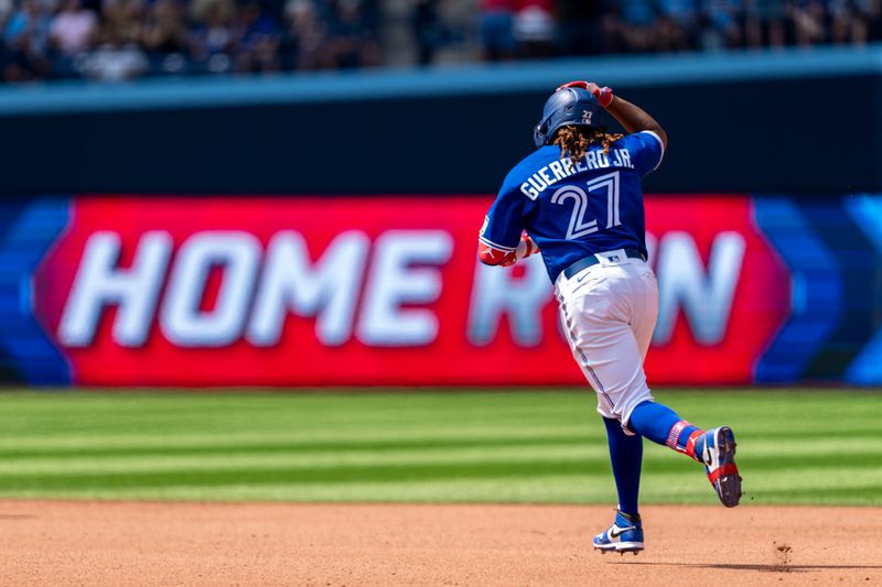 Jul 20, 2023; Toronto, Ontario, CAN; Toronto Blue Jays first baseman Vladimir Guerrero Jr. (27) hits a home run against the San Diego Padres during the seventh inning at Rogers Centre. Mandatory Credit: Kevin Sousa-USA TODAY Sports