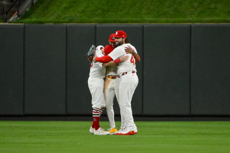 Jul 10, 2025; St. Louis, Missouri, USA;  St. Louis Cardinals left fielder Garrett Hampson (13) center fielder Victor Scott II (11) and right fielder Alec Burleson (41) celebrate after the Cardinals defeated the Washington Nationals at Busch Stadium. Mandatory Credit: Jeff Curry-Imagn Images