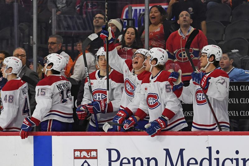 Oct 27, 2024; Philadelphia, Pennsylvania, USA; Montreal Canadiens players celebrate win against the Philadelphia Flyers at Wells Fargo Center. Mandatory Credit: Eric Hartline-Imagn Images