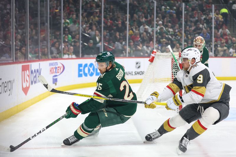 Apr 3, 2023; Saint Paul, Minnesota, USA; Minnesota Wild defenseman Jonas Brodin (25) skates with the puck while Vegas Golden Knights center Jack Eichel (9) defends during the first period at Xcel Energy Center. Mandatory Credit: Matt Krohn-USA TODAY Sports