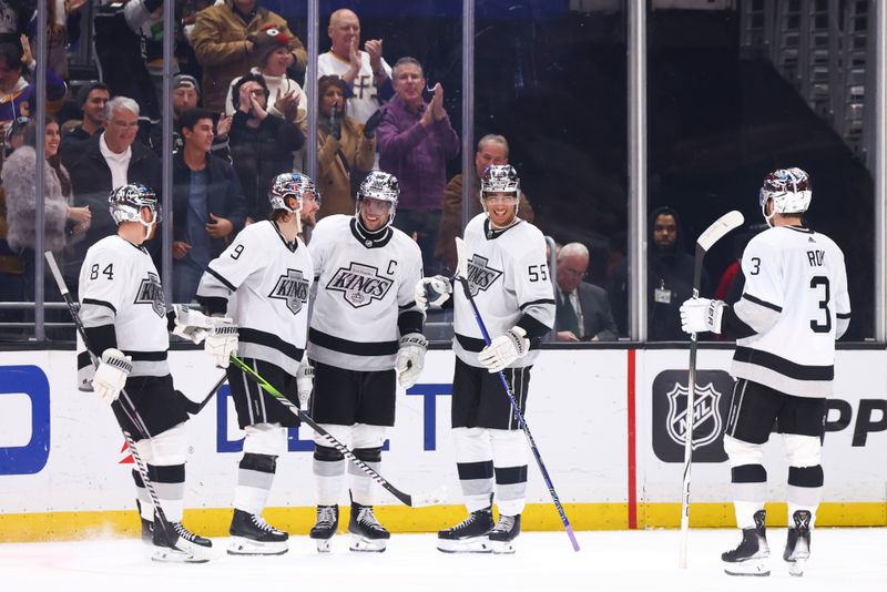 Dec 27, 2023; Los Angeles, California, USA; Los Angeles Kings right wing Adrian Kempe (9) celebrates with his teammates after scoring a goal during the third period of a game against the San Jose Sharks at Crypto.com Arena. Mandatory Credit: Jessica Alcheh-USA TODAY Sports
