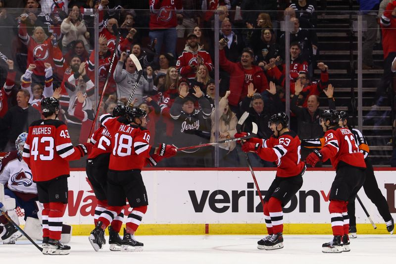 Feb 6, 2024; Newark, New Jersey, USA; New Jersey Devils defenseman John Marino (6) celebrates his goal against the Colorado Avalanche during the third period at Prudential Center. Mandatory Credit: Ed Mulholland-USA TODAY Sports