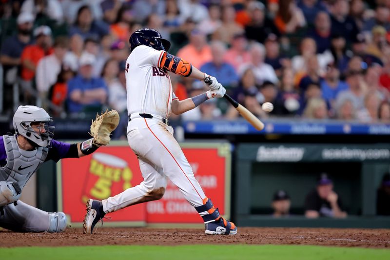 Jun 26, 2024; Houston, Texas, USA; Houston Astros catcher Cesar Salazar (18) hits an RBI sacrifice fly against the Colorado Rockies during the seventh inning at Minute Maid Park. Mandatory Credit: Erik Williams-USA TODAY Sports