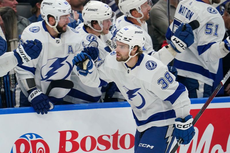 Nov 6, 2023; Toronto, Ontario, CAN; Tampa Bay Lightning forward Brandon Hagel (38) celebrates with teammates after scoring the tying goal during the third period to send the game to overtime at Scotiabank Arena. Mandatory Credit: John E. Sokolowski-USA TODAY Sports