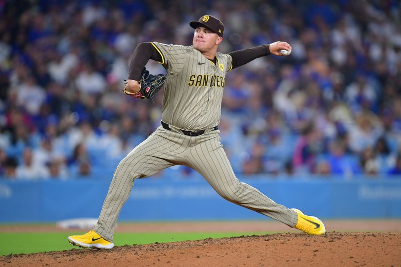 Sep 24, 2024; Los Angeles, California, USA; San Diego Padres pitcher Adrian Morejon (50) throws against the Los Angeles Dodgers during the sixth inning at Dodger Stadium. Mandatory Credit: Gary A. Vasquez-Imagn Images