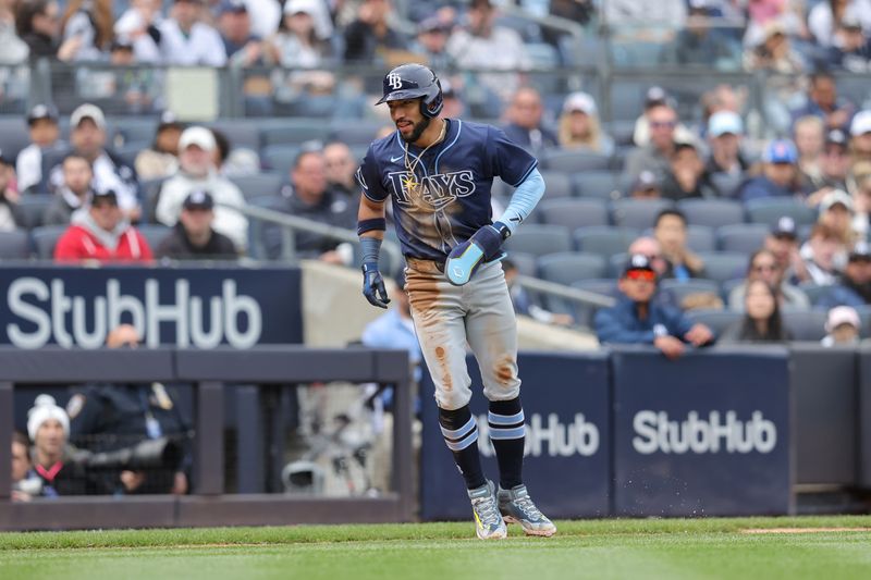 Apr 21, 2024; Bronx, New York, USA; Tampa Bay Rays shortstop Jose Caballero (7) scores from third on a balk by New York Yankees starting pitcher Luis Gil (not pictured) during the third inning at Yankee Stadium. Mandatory Credit: Brad Penner-USA TODAY Sports