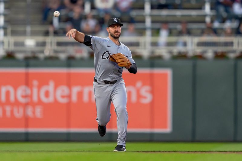 Apr 22, 2024; Minneapolis, Minnesota, USA; Chicago White Sox shortstop Paul DeJong (29) throws the ball to first base for an out against the Minnesota Twins in the fifth inning at Target Field. Mandatory Credit: Jesse Johnson-USA TODAY Sports