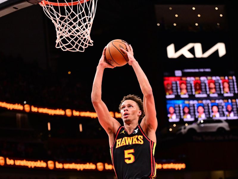 ATLANTA, GA - FEBRUARY 23: Dyson Daniels #5 of the Atlanta Hawks dunks the ball during the game against the Detroit Pistons on February 23, 2025 at State Farm Arena in Atlanta, Georgia.  NOTE TO USER: User expressly acknowledges and agrees that, by downloading and/or using this Photograph, user is consenting to the terms and conditions of the Getty Images License Agreement. Mandatory Copyright Notice: Copyright 2025 NBAE (Photo by Adam Hagy/NBAE via Getty Images)