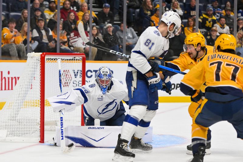 Oct 28, 2025; Nashville, Tennessee, USA;  Tampa Bay Lightning goaltender Andrei Vasilevskiy (88) blocks the shot of Nashville Predators right wing Luke Evangelista (77) during the third period at Bridgestone Arena. Mandatory Credit: Steve Roberts-Imagn Images
