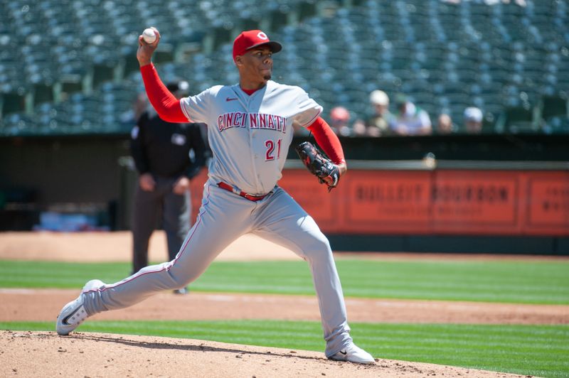 Apr 29, 2023; Oakland, California, USA; Cincinnati Reds starting pitcher Hunter Greene (21) throws a pitch during the first inning against the Oakland Athletics at RingCentral Coliseum. Mandatory Credit: Ed Szczepanski-USA TODAY Sports