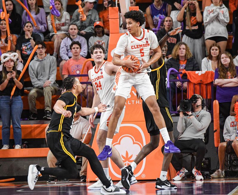 Feb 27, 2024; Clemson, South Carolina, USA; Clemson graduate Jack Clark (5) rebounds playing University of Pitt  during the second half at Littlejohn Coliseum. Mandatory Credit: Ken Ruinard-USA TODAY Sports