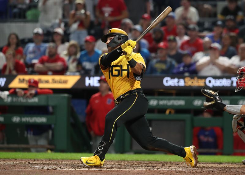 Jun 6, 2025; Pittsburgh, Pennsylvania, USA;  Pittsburgh Pirates second baseman Nick Gonzales (39) hits a game winning sacrifice fly RBI to defeat the Philadelphia Phillies during the ninth inning at PNC Park. Mandatory Credit: Charles LeClaire-Imagn Images