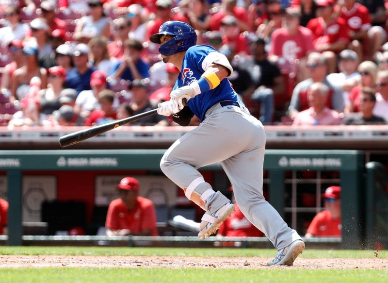 Sep 3, 2023; Cincinnati, Ohio, USA; Chicago Cubs right fielder Seiya Suzuki (27) hits a single against the Cincinnati Reds during the eighth inning at Great American Ball Park. Mandatory Credit: David Kohl-USA TODAY Sports