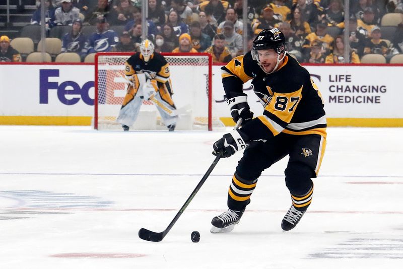 Apr 6, 2024; Pittsburgh, Pennsylvania, USA;  Pittsburgh Penguins center Sidney Crosby (87) skates up ice with the puck against he Tampa Bay Lightning during the first period at PPG Paints Arena. The Penguins won 5-4. Mandatory Credit: Charles LeClaire-USA TODAY Sports