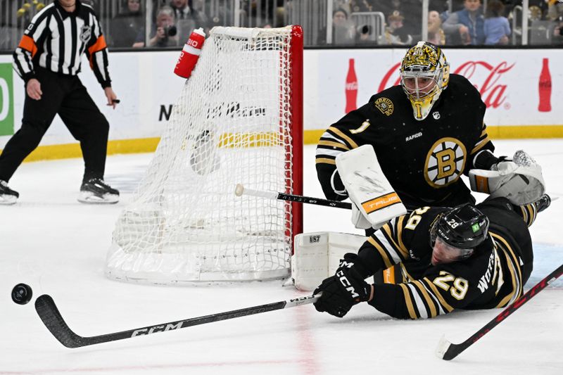 Feb 10, 2024; Boston, Massachusetts, USA; Boston Bruins defenseman Parker Wotherspoon (29) clears the puck in front of goaltender Jeremy Swayman (1) during the second period of a game against the Washington Capitals at the TD Garden. Mandatory Credit: Brian Fluharty-USA TODAY Sports