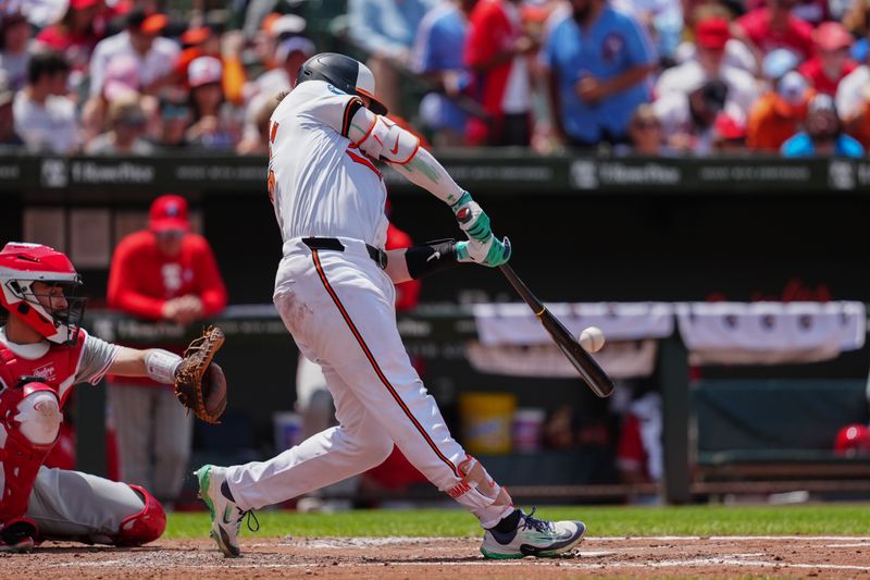 Jun 16, 2024; Baltimore, Maryland, USA; Baltimore Orioles catcher Adley Rutschman (35) hits a home run against the Philadelphia Phillies during the third inning at Oriole Park at Camden Yards. Mandatory Credit: Gregory Fisher-USA TODAY Sports