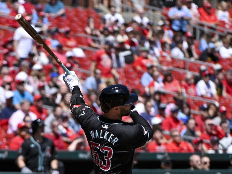 Apr 24, 2024; St. Louis, Missouri, USA;  Arizona Diamondbacks first baseman Christian Walker (53) hits a one run sacrifice fly against the St. Louis Cardinals during the first inning at Busch Stadium. Mandatory Credit: Jeff Curry-USA TODAY Sports