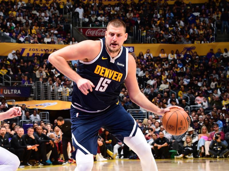 LOS ANGELES, CA - NOVEMBER 23: Nikola Jokic #15 of the Denver Nuggets dribbles the ball during the game against the Los Angeles Lakers on November 23, 2024 at Crypto.Com Arena in Los Angeles, California. NOTE TO USER: User expressly acknowledges and agrees that, by downloading and/or using this Photograph, user is consenting to the terms and conditions of the Getty Images License Agreement. Mandatory Copyright Notice: Copyright 2024 NBAE (Photo by Adam Pantozzi/NBAE via Getty Images)