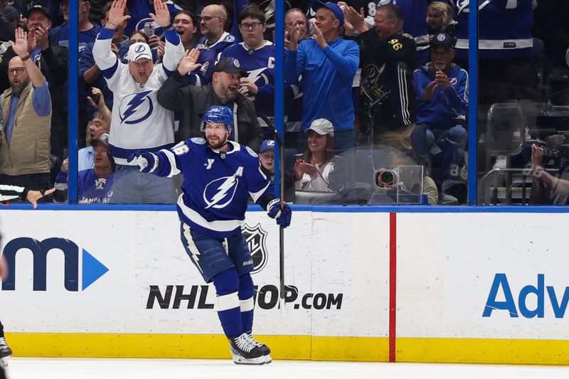 Mar 4, 2025; Tampa, Florida, USA; Tampa Bay Lightning right wing Nikita Kucherov (86) celebrates after scoring a goal against the Columbus Blue Jackets in the first period  at Amalie Arena. Mandatory Credit: Nathan Ray Seebeck-Imagn Images
