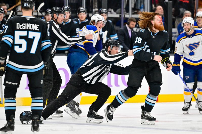 Jan 18, 2025; Salt Lake City, Utah, USA; Linesperson Travis Gawryletz (67) breaks up a fight between Utah Hockey Club center Liam O'Brien (38) and St. Louis Blues defenseman Tyler Tucker (75) during first period at the Delta Center. Mandatory Credit: Christopher Creveling-Imagn Images