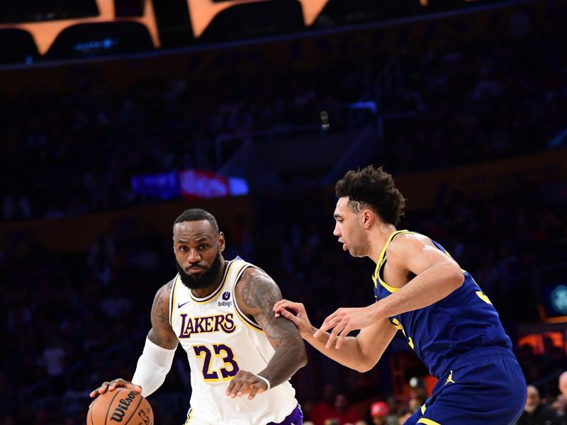 LOS ANGELES, CA - MACH 16: LeBron James #23 of the Los Angeles Lakers dribbles the ball during the game against the Golden State Warriors on March 16, 2024 at Crypto.Com Arena in Los Angeles, California. NOTE TO USER: User expressly acknowledges and agrees that, by downloading and/or using this Photograph, user is consenting to the terms and conditions of the Getty Images License Agreement. Mandatory Copyright Notice: Copyright 2024 NBAE (Photo by Adam Pantozzi/NBAE via Getty Images)