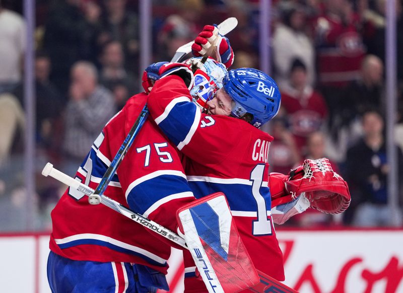 Jan 20, 2026; Montreal, Quebec, CAN; Montreal Canadiens goalie Jakub Dobes (75) and teammate forward Cole Caufield (13) celebrate the win against the Minnesota Wild at the Bell Centre. Mandatory Credit: Eric Bolte-Imagn Images