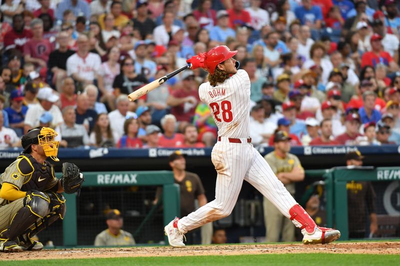 Jun 17, 2024; Philadelphia, Pennsylvania, USA; Philadelphia Phillies third base Alec Bohm (28) hits a three run home run during the fifth inning against the San Diego Padres at Citizens Bank Park. Mandatory Credit: Eric Hartline-USA TODAY Sports